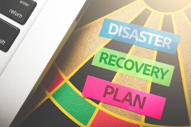 the words disaster recovery plan  against a dart board